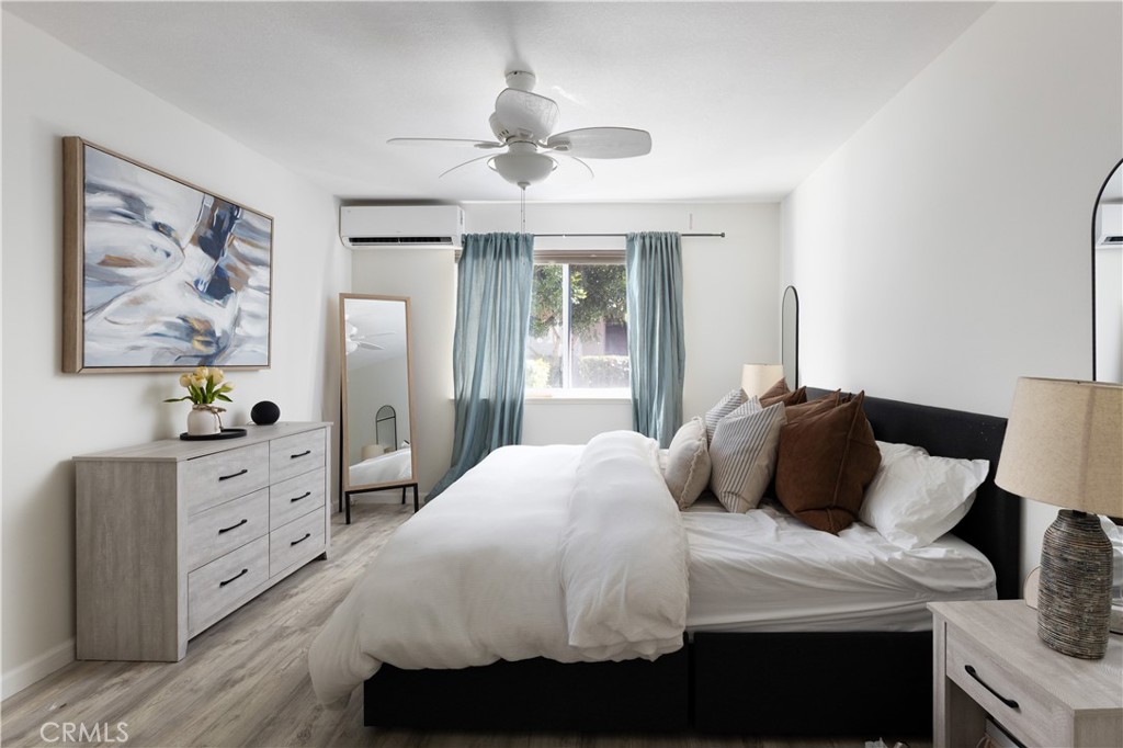 12200 Montecito Road, Unit D104 Seal Beach, CA 90740 - Photo 16 of 25 a bedroom with a bed and a dresser