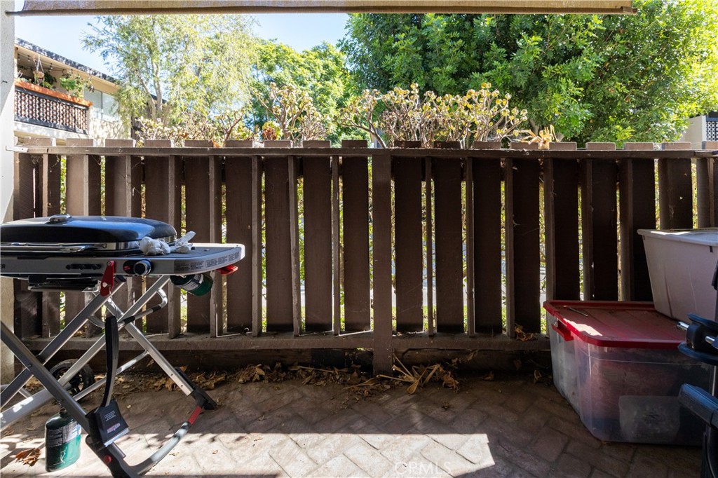 12200 Montecito Road, Unit D104 Seal Beach, CA 90740 - Photo 10 of 25 a view of porch with chairs and wooden fence