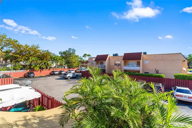 a view of a couch sitting in the backyard of a house