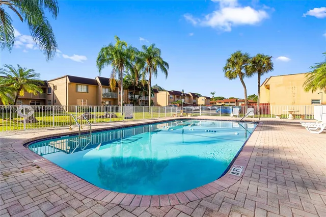 a view of a swimming pool with a lounge chair