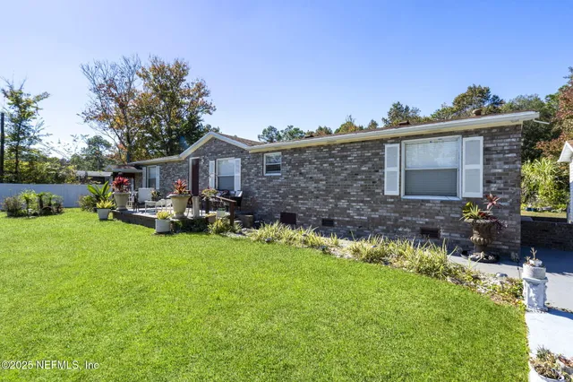 a aerial view of a house with swimming pool and garden