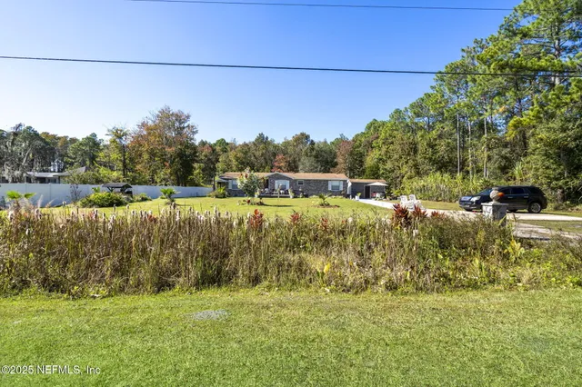 a view of a lake with houses in the back