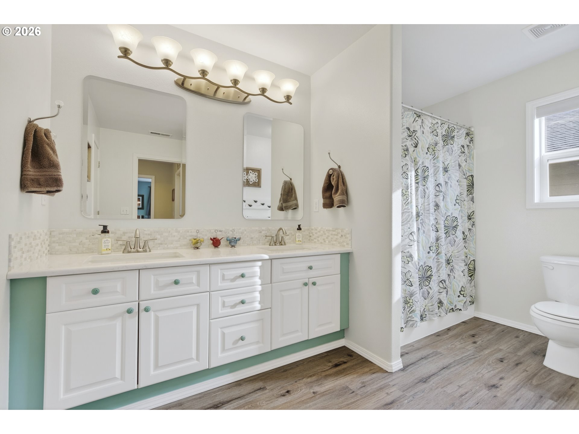 163 Southwest Sandlewood Loop Gresham, OR 97030 - Photo 24 of 47 a bathroom with a granite countertop sink a toilet a mirror a vanity and shower
