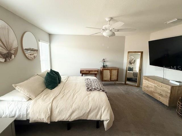 5497 Southeast 91st Street Ocala, FL 34480 - Photo 14 of 29 a bedroom with a bed and a flat screen tv