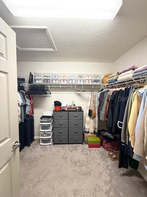 5497 Southeast 91st Street Ocala, FL 34480 - Photo 18 of 29 a view of walk in closet with clothes and shoes