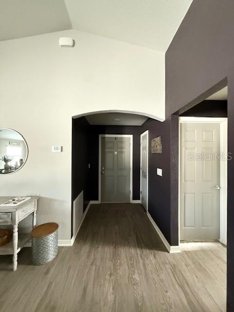 5497 Southeast 91st Street Ocala, FL 34480 - Photo 5 of 29 a view of a room with wooden floor and chair