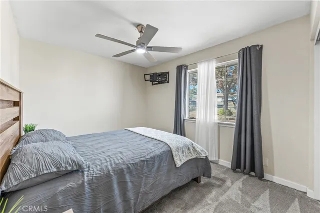 a bedroom with a bed and a bookshelf