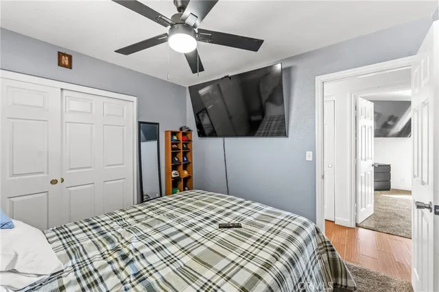 a bathroom with a granite countertop sink a mirror and shower