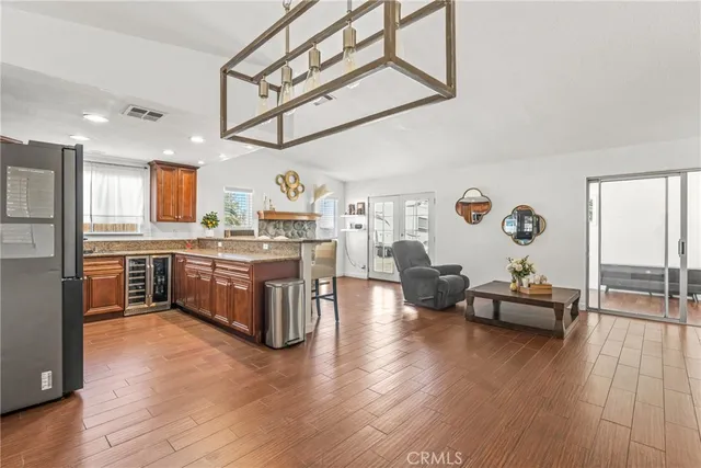 a view of a room with wooden floor and windows