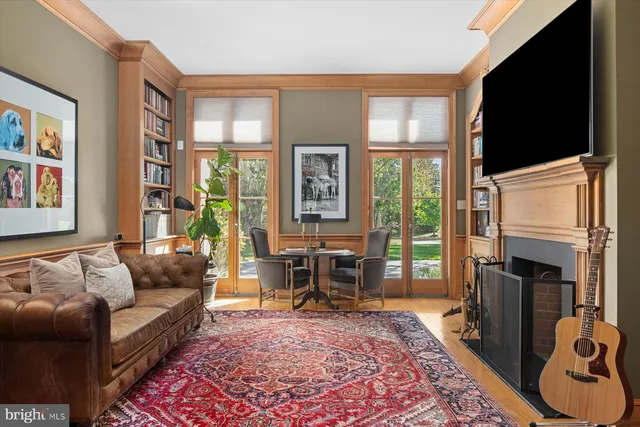 a living room with furniture fireplace and flat screen tv