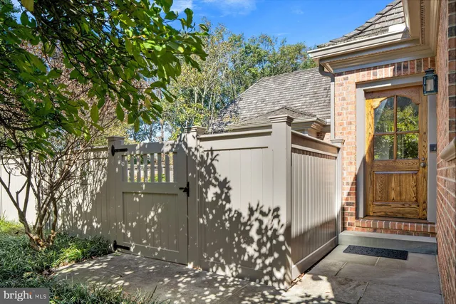 a bathroom with a granite countertop sink and a window