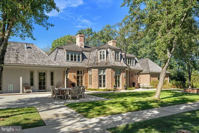 a view of a swimming pool with chairs