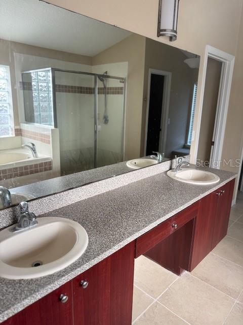 386 Haversham Road Deltona, FL 32725 - Photo 13 of 39 a bathroom with a granite countertop sink and a mirror