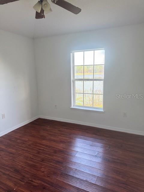 386 Haversham Road Deltona, FL 32725 - Photo 16 of 39 wooden floor in an empty room with a window
