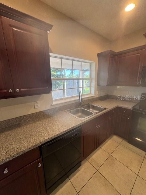 386 Haversham Road Deltona, FL 32725 - Photo 24 of 39 a kitchen with granite countertop a sink and a stove