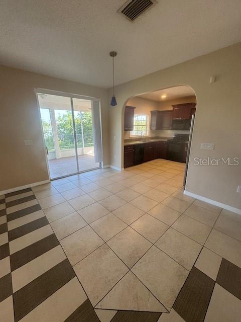386 Haversham Road Deltona, FL 32725 - Photo 29 of 39 a view of a livingroom with a black and white checkered floor