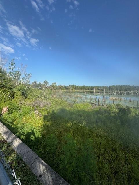 386 Haversham Road Deltona, FL 32725 - Photo 5 of 39 a view of a lake with houses in the back
