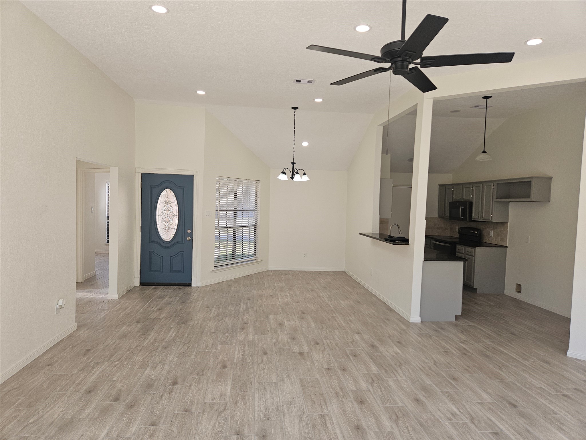 4426 Waterfall Way Sugar Land, TX 77479 - Photo 5 of 11 a view of a kitchen with a sink and a stove top oven