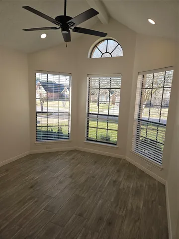 a view of an empty room with a window