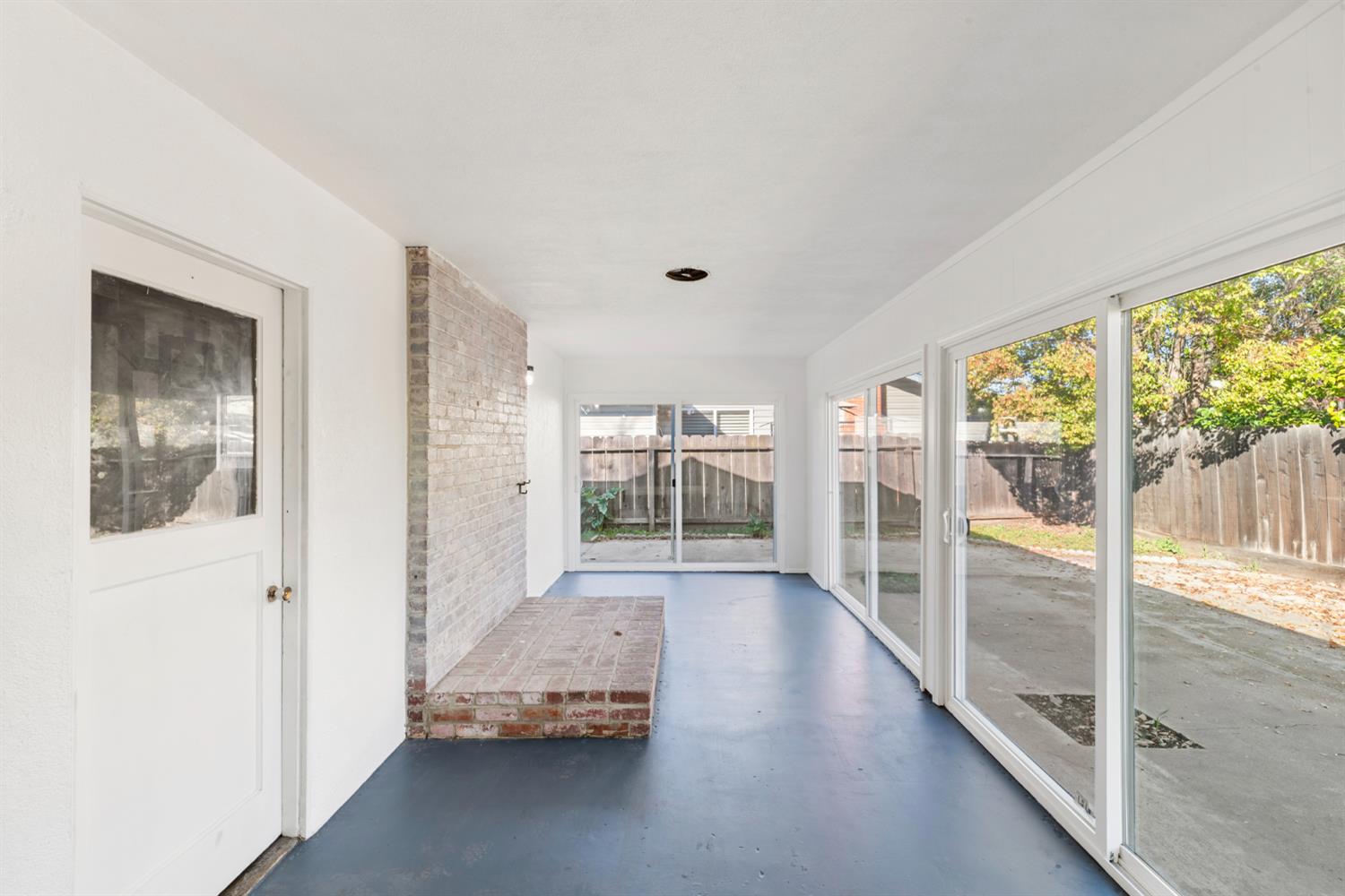 1713 Wolverine Way Modesto, CA 95355 - Photo 18 of 28 a view of a big room with wooden floor and windows