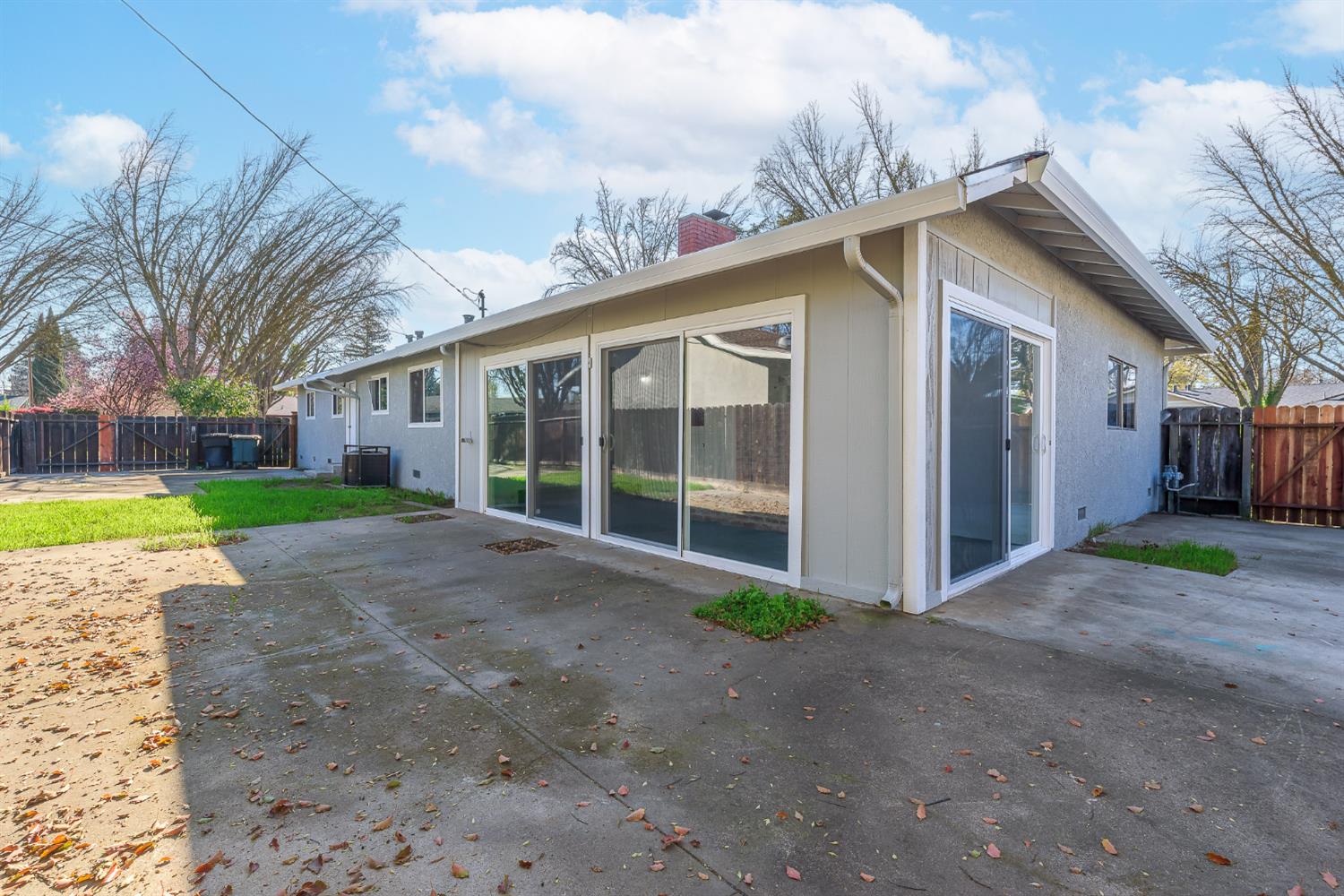 1713 Wolverine Way Modesto, CA 95355 - Photo 21 of 28 a view of a house with a yard