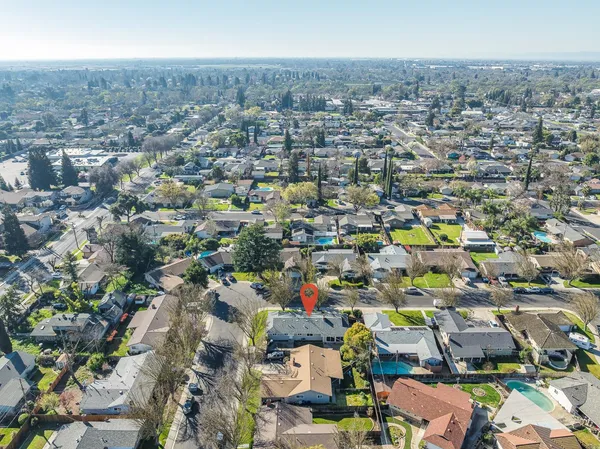 an aerial view of residential building and parking space