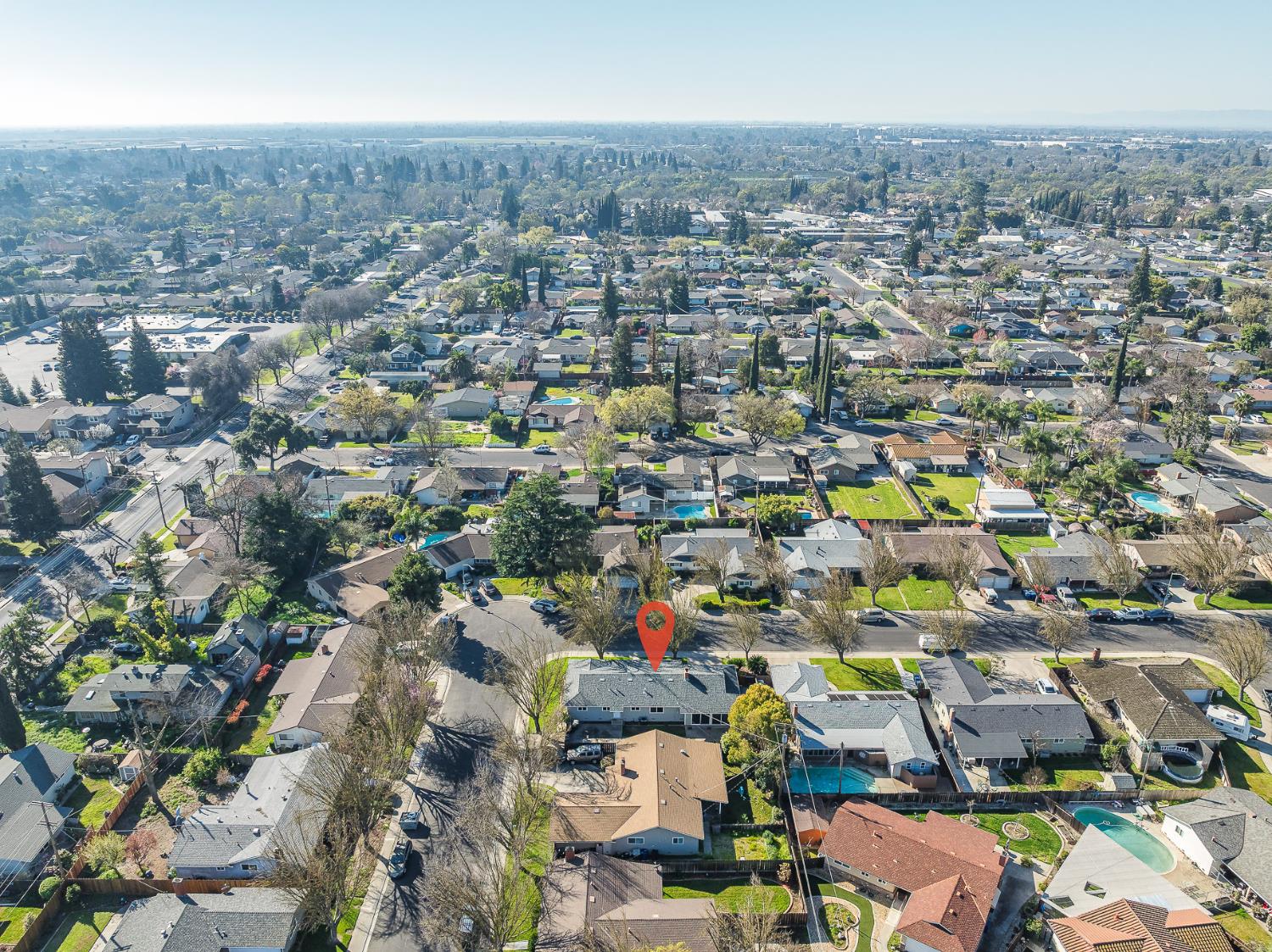 1713 Wolverine Way Modesto, CA 95355 - Photo 25 of 28 an aerial view of a city with lots of residential buildings