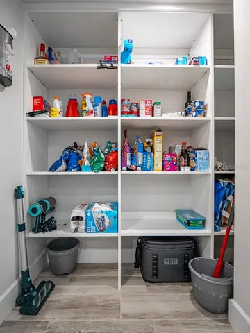 a bedroom with a bed and a flat tv screen on the dresser