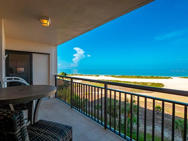 a view of balcony with furniture