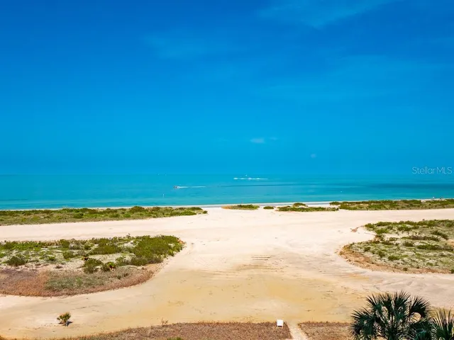 a bathroom with a toilet a sink and a wooden floor
