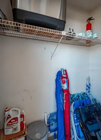 a view of swimming pool with a table and chairs