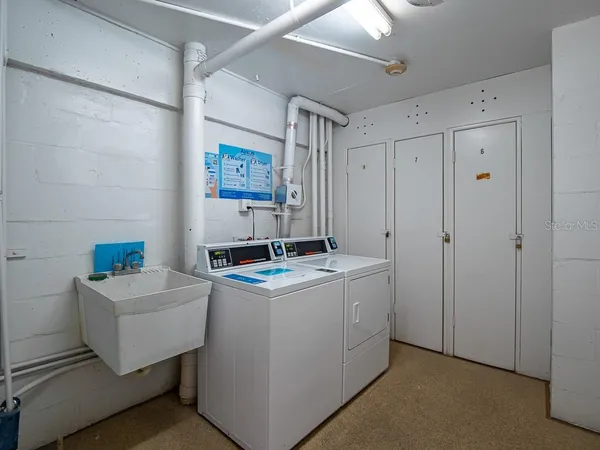 a view of swimming pool with outdoor seating