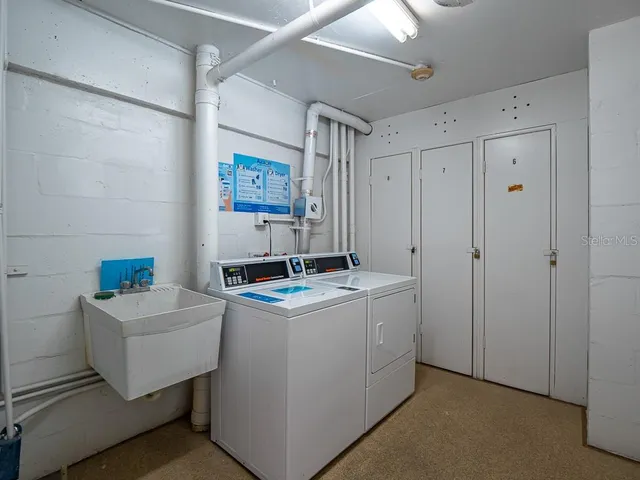 a view of swimming pool with outdoor seating