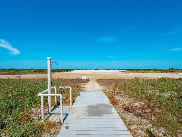 a kitchen with a stove sink and cabinets