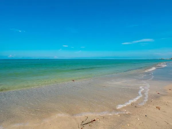 a view of a building with a yard and sitting area