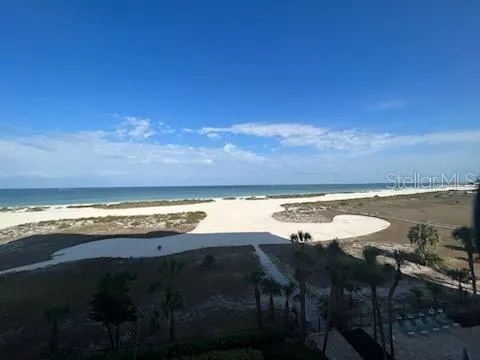 a front view of a building and trees