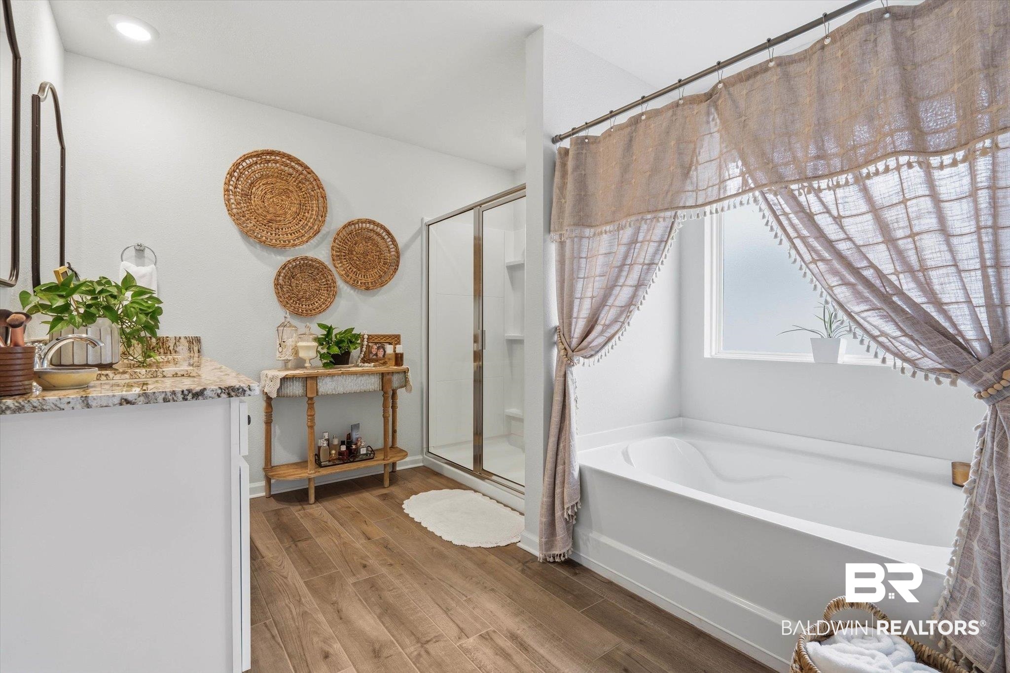 17041 Muse Street Loxley, AL 36551 - Photo 14 of 44 Bathroom featuring a shower stall, a garden tub, light wood finished floors, and vanity