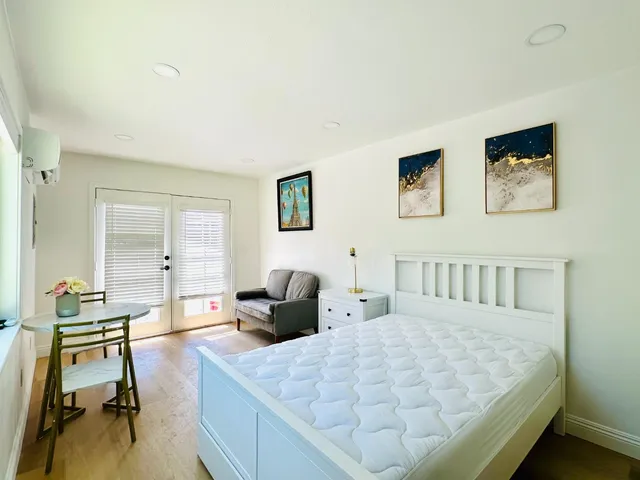 a bed room with a bed and a couch