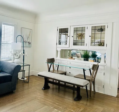 a dining room with furniture and window