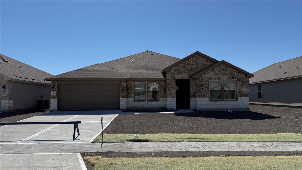 a front view of a house with garage