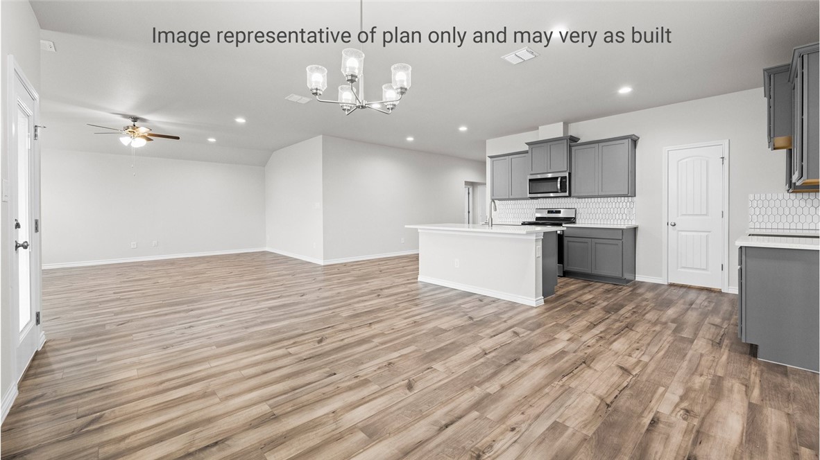1409 Irigoyen Street Corpus Christi, TX 78415 - Photo 13 of 38 a view of kitchen with sink microwave and stove