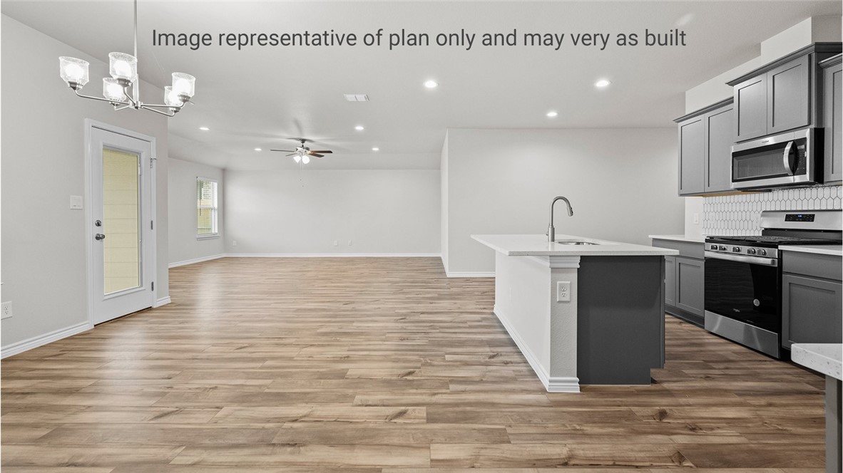 1409 Irigoyen Street Corpus Christi, TX 78415 - Photo 14 of 38 a kitchen with stainless steel appliances granite countertop a sink counter space and cabinets