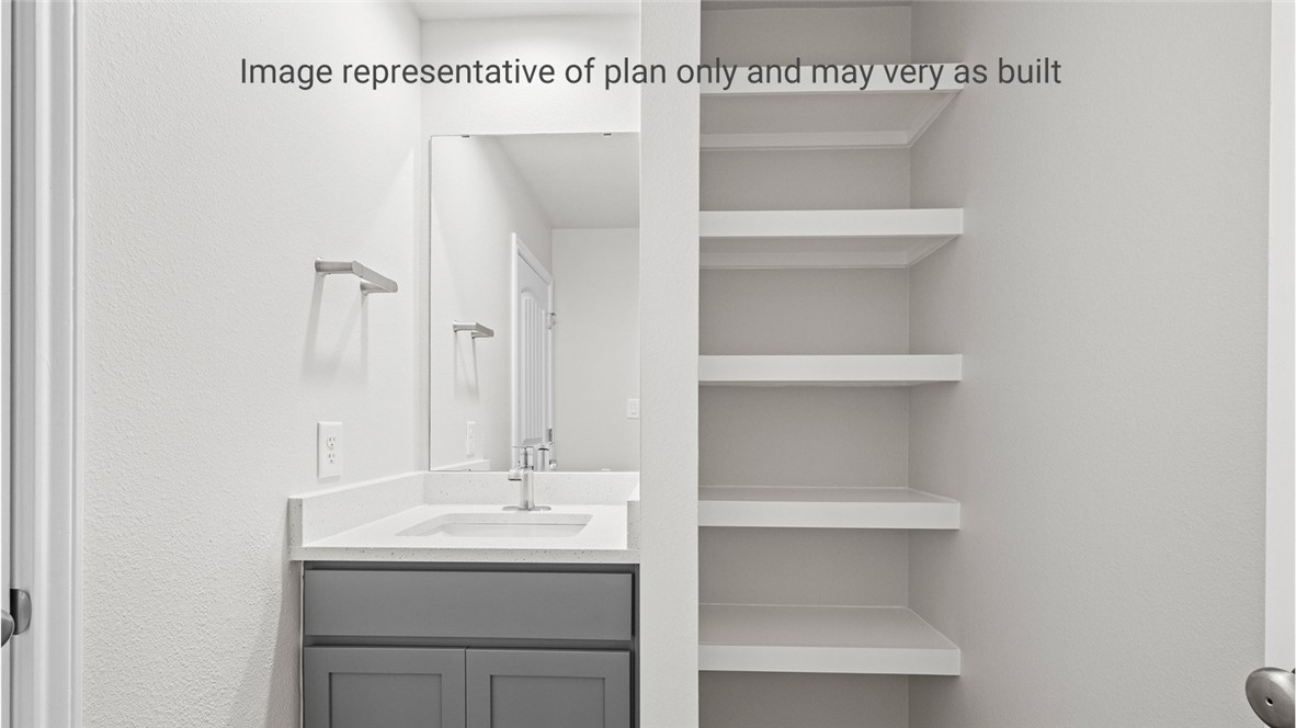 1409 Irigoyen Street Corpus Christi, TX 78415 - Photo 22 of 38 a bathroom with a sink and a toilet