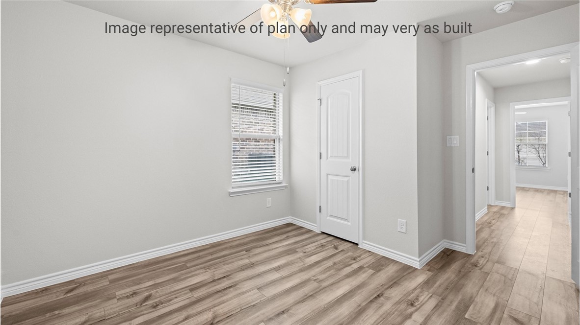 1409 Irigoyen Street Corpus Christi, TX 78415 - Photo 24 of 38 wooden floor in an empty room with a window