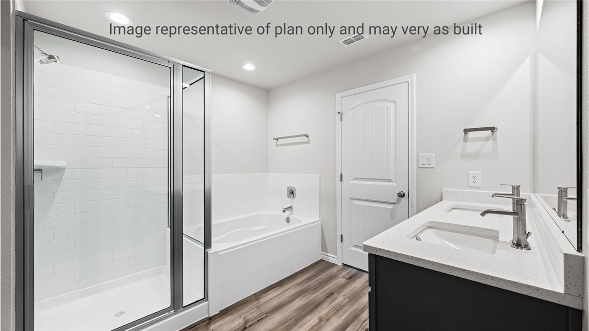 1409 Irigoyen Street Corpus Christi, TX 78415 - Photo 29 of 38 a bathroom with a bathtub a shower a sink and a mirror