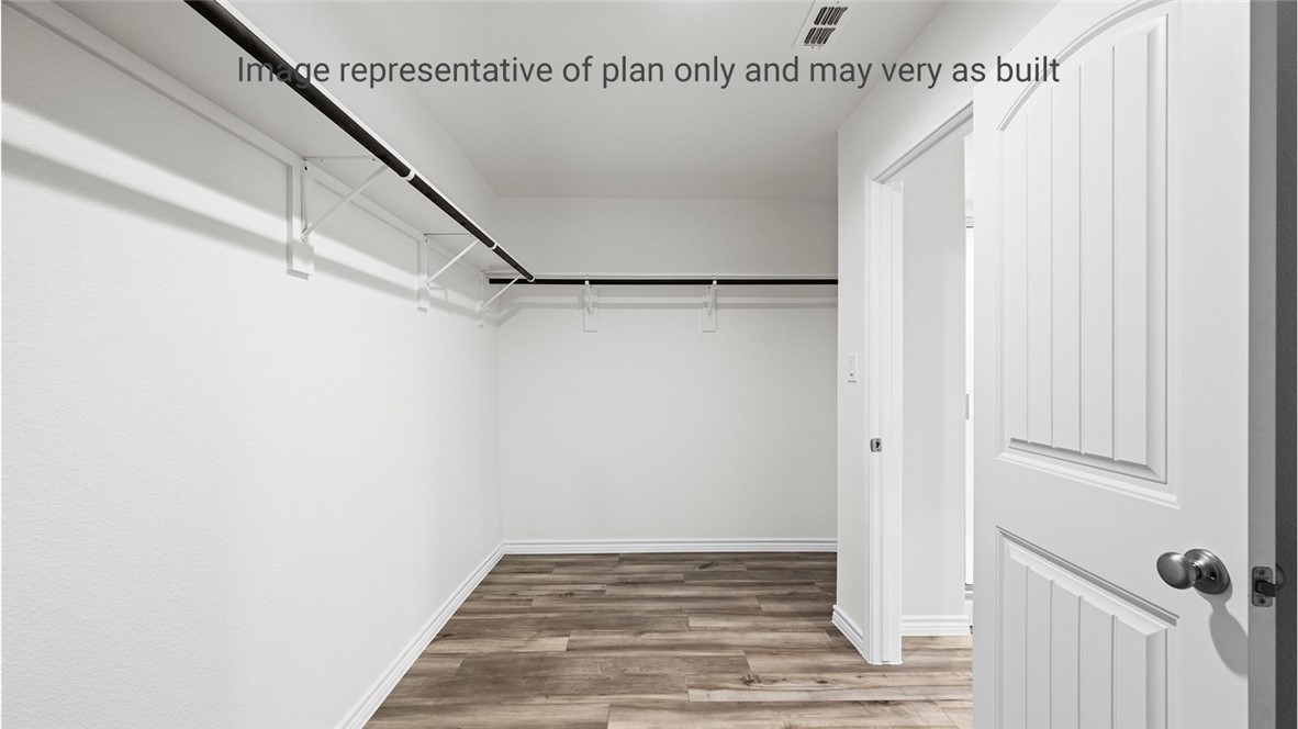 1409 Irigoyen Street Corpus Christi, TX 78415 - Photo 32 of 38 a view of a room with wooden floor