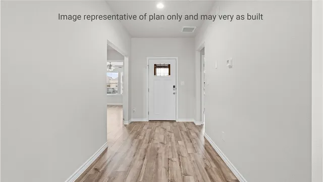 a kitchen with stainless steel appliances granite countertop a sink and a microwave