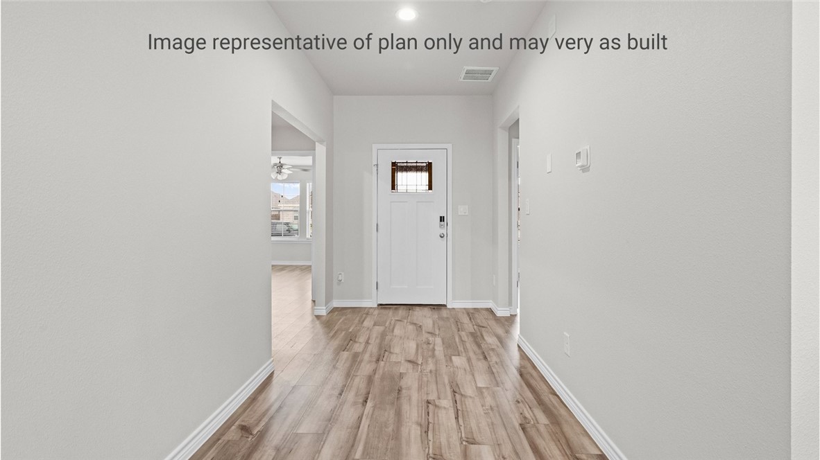 1409 Irigoyen Street Corpus Christi, TX 78415 - Photo 8 of 38 a view of a room with wooden floor and staircase