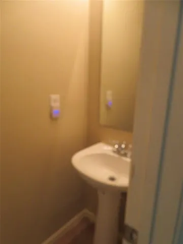 a bathroom with a sink and mirror