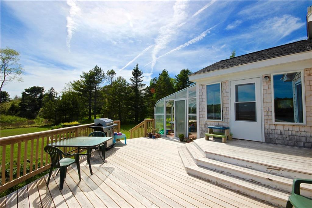 628 Pleasant Point Road Cushing, ME 04563 - Photo 7 of 17 Deck looking into solarium and kitchen